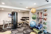 Thumbnail 20 of 29 - a home gym with a punching bag and weights at Hamilton at Kings Place, Columbia Maryland