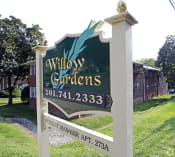 Thumbnail 9 of 16 - a sign in front of a building that says willow gardens