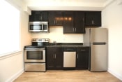 Thumbnail 19 of 33 - Kitchen with stainless steel appliances at The Gallery Midtown Apartments in Richmond, VA