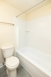 Thumbnail 17 of 39 - a bathroom with a toilet and a bathtub at Seminary Roundtop Apartments, Lutherville, MD