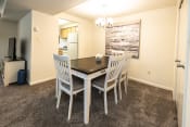 Thumbnail 6 of 22 - a dining room with a table and chairs at Chapel Valley Townhomes, Maryland