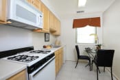 Thumbnail 1 of 18 - Kitchen With Dining at Rockdale Gardens Apartments*, Baltimore, Maryland