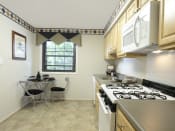 Thumbnail 7 of 24 - Bright eat in kitchen at Liberty Gardens Apartments, Baltimore, MD 21244
