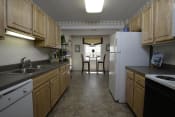 Thumbnail 65 of 66 - Kitchen with wooden cabinets and a white refrigerator at Ivy Hall Apartments*, Towson