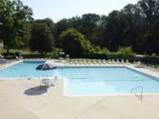 Thumbnail 17 of 22 - Lounging by the Pool at Woodridge Apartments, Maryland 21133