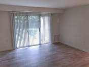 Thumbnail 39 of 39 - an empty living room with a sliding glass door at Seminary Roundtop Apartments, Lutherville, 21093