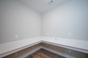 Thumbnail 62 of 65 - an empty room with a hardwood floor and white walls