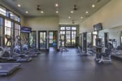 Thumbnail 6 of 28 - the fitness center has cardio equipment and weights in a large room with windows
