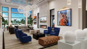 Thumbnail 9 of 13 - lobby with blue chairs and couches and a fireplace at Altis Grand Suncoast, Florida, 34638