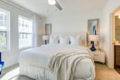 Thumbnail 4 of 13 - a bedroom with a large bed and two windows at Altis Grand Suncoast, Land O' Lakes, FL, 34638