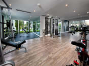 Thumbnail 7 of 12 - a gym with a wood floor and lots of windows at Saba Pompano Beach, Pompano Beach, 33062