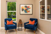 Thumbnail 16 of 26 - two blue chairs with orange pillows in a room with two windows