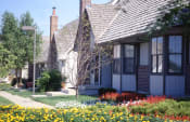 Thumbnail 24 of 26 - a row of houses with flowers in front of them