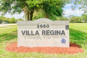 Thumbnail 1 of 16 - Monument sign in front of Villa Regina Senior Apartments