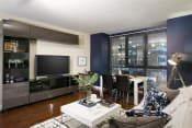 Thumbnail 8 of 33 - Living Room with modern entertainment console at Wilshire Vermont, Los Angeles