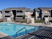 Thumbnail 13 of 23 - Pool Side Relaxing Area at Park West Apartments, Chino, California