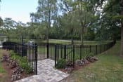 Thumbnail 16 of 16 - Fenced in courtyard area overlooking pond