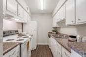 Thumbnail 6 of 15 - Galley style kitchen  at Forest Gardens, Dallas, TX, 75243 