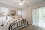 Thumbnail 7 of 13 - Bedroom with walk-in closet and private patio  at Edgewood Village, Lewisville, TX