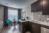 Thumbnail 59 of 78 - kitchen cabinets with dining table and chairs  at EdgeWater at City Center, Lenexa, 66219
