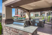 Thumbnail 7 of 78 - an outdoor grill area with two bbq grills  at EdgeWater at City Center, Lenexa, 66219