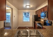 Thumbnail 2 of 11 - Kitchen with Electric Appliances at Georgetown Apartments, Williamsville, NY