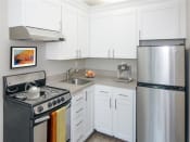 Thumbnail 20 of 22 - Gourmet Kitchen with White Cabinetry at Parkridge Apartments, Lake Oswego
