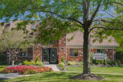 Thumbnail 9 of 35 - mature tree and landscaping outside leasing center 