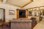 Thumbnail 20 of 30 - Lounge Area With TV at Dartmouth Tower at Shaw, Clovis, CA, 93612