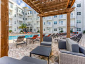 Thumbnail 15 of 17 - Outdoor Grill With Intimate Seating Area at Lake Lofts at Deerwood, Jacksonville, Florida