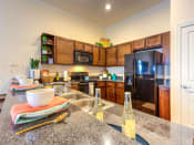 Thumbnail 8 of 17 - Granite Counter Tops In Kitchen at Lake Lofts at Deerwood, Jacksonville, Florida