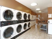 Thumbnail 22 of 26 - Onsite laundry facility at the Gates of Rochester Apartments