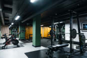Thumbnail 8 of 8 - a gym with weights and other exercise equipment