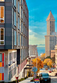 a view of a city street with a tall building in the distance at Addison on Fourth, Seattle, Washington