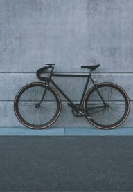 a bike parked against the side of a wall at Baldwyn, Seattle