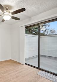 A white closet with a bench and a hanger.