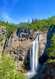 a waterfall on the side of a mountain