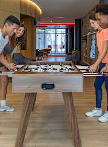 People playing foosball at Icon One, Daytona Beach