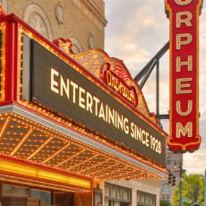 a marquee of a theater in the city at night