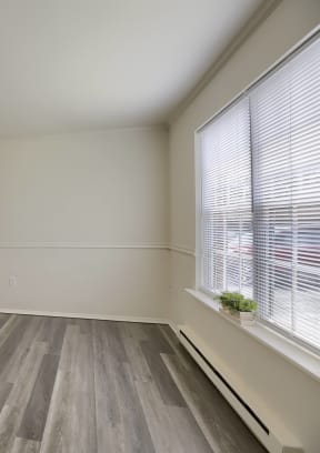 a bedroom with a carpeted floor and two closets
