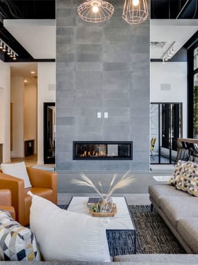 a living room with a couch and a fireplace