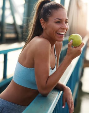 a woman eating an apple