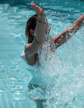 a girl swimming in the water in a poolat The Slate, Jeffersonville Indiana