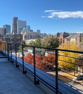 a balcony with a view of the boston skyline