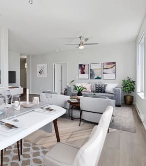 a living room filled with furniture and a large chandelier