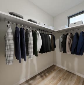 a large walk in closet with a window
