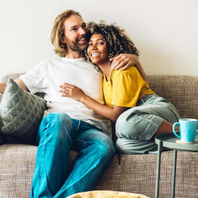 a man and a woman sitting on a couch