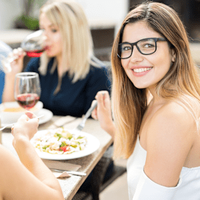 A group of people enjoying a meal together at a restaurant.