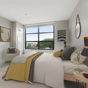 a bedroom with a large bed and a window