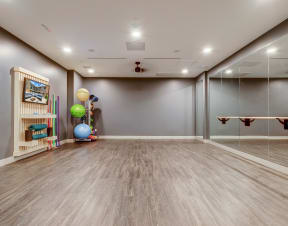 a play room with mirrors and toys on the wall